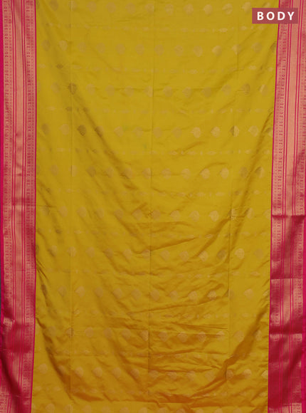 Semi soft silk saree yellow and pink with allover zari woven buttas and zari woven border