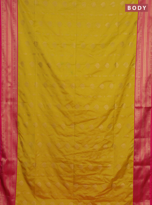 Semi soft silk saree yellow and pink with allover zari woven buttas and zari woven border