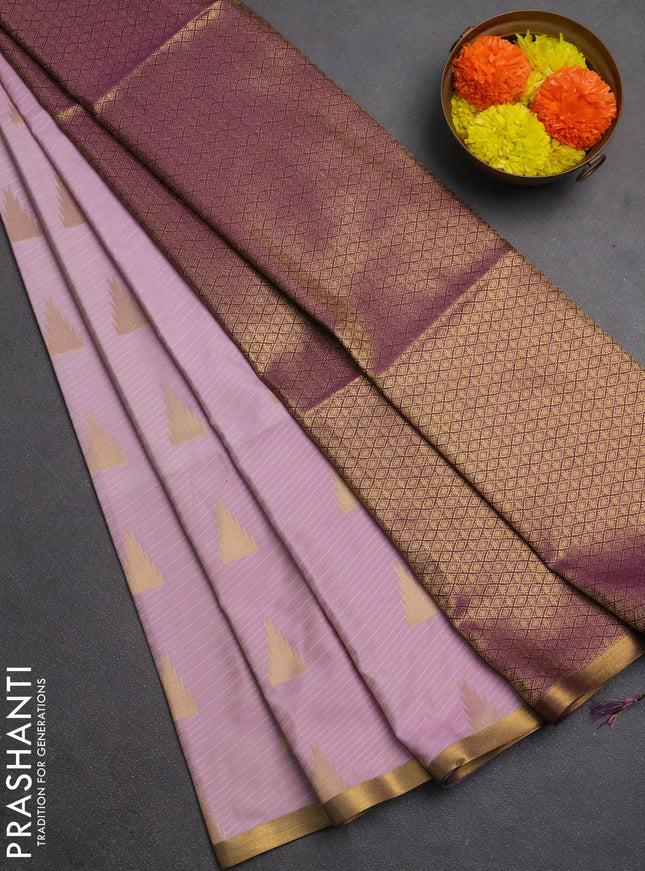 Semi soft silk saree pastel pink and purple with allover temple design zari woven buttas and zari woven piping border