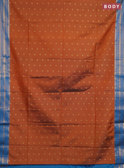 Semi soft silk saree rust shade and cs blue with allover zari checks & buttas and zari woven border
