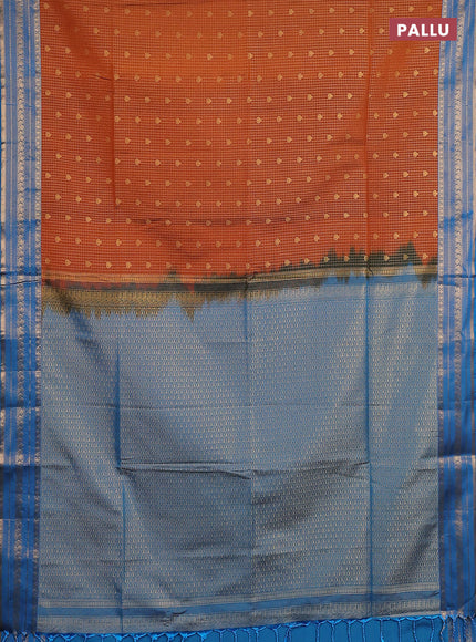 Semi soft silk saree rust shade and cs blue with allover zari checks & buttas and zari woven border