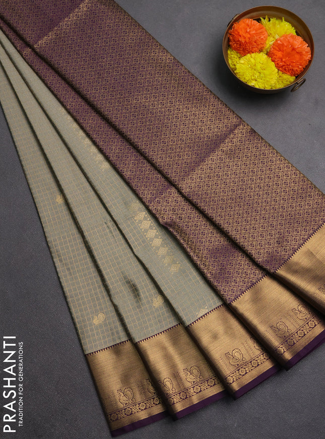 Semi soft silk saree grey shade and purple with allover zari checks & buttas and rich zari woven border