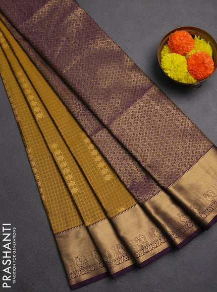 Semi soft silk saree dark mustard and purple with allover zari checks & buttas and rich zari woven border