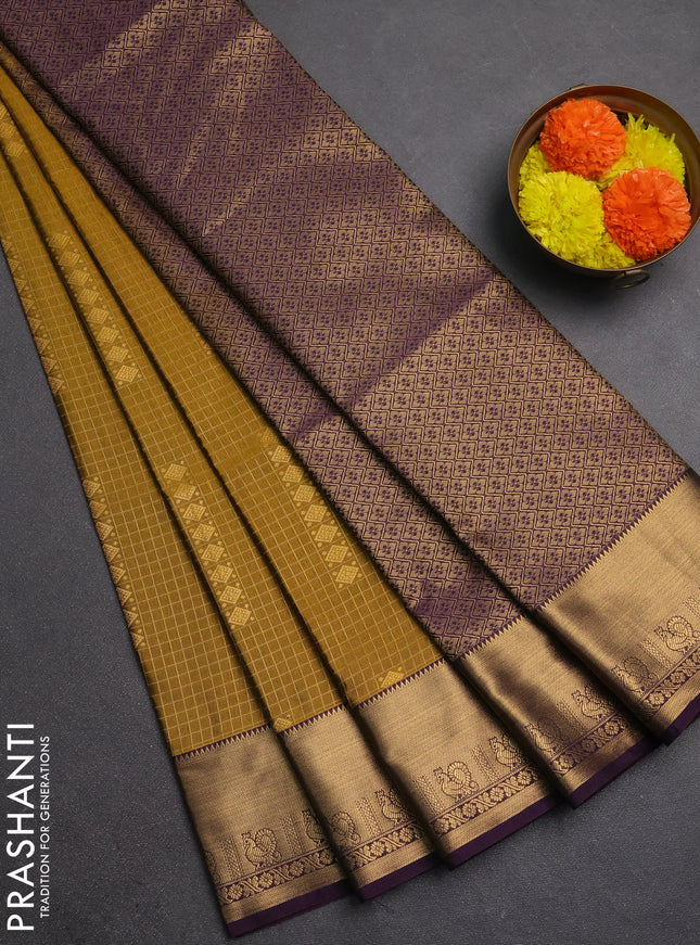 Semi soft silk saree dark mustard and purple with allover zari checks & buttas and rich zari woven border