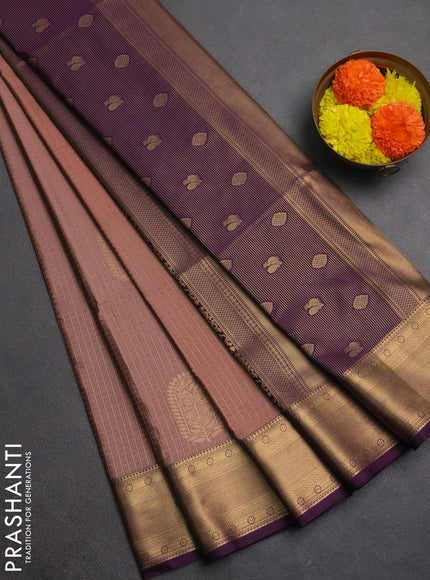 Semi soft silk saree peach shade and purple with allover zari checks & buttas and zari woven border