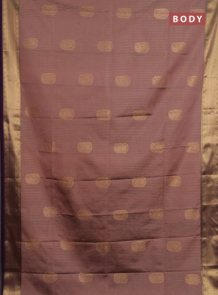Semi soft silk saree peach shade and purple with allover zari checks & buttas and zari woven border