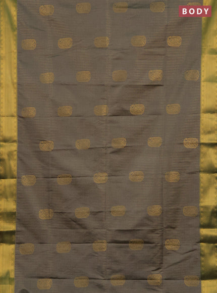 Semi soft silk saree grey and teal green with allover zari checks & buttas and zari woven border