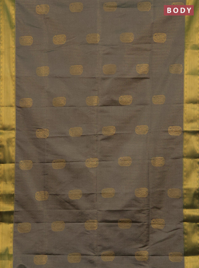 Semi soft silk saree grey and teal green with allover zari checks & buttas and zari woven border
