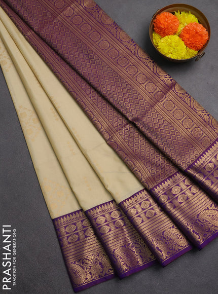 Semi soft silk saree beige and purple with allover zari woven buttas and zari woven border