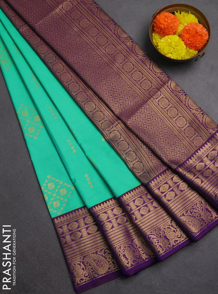 Semi soft silk saree green and purple with allover zari woven buttas and zari woven border