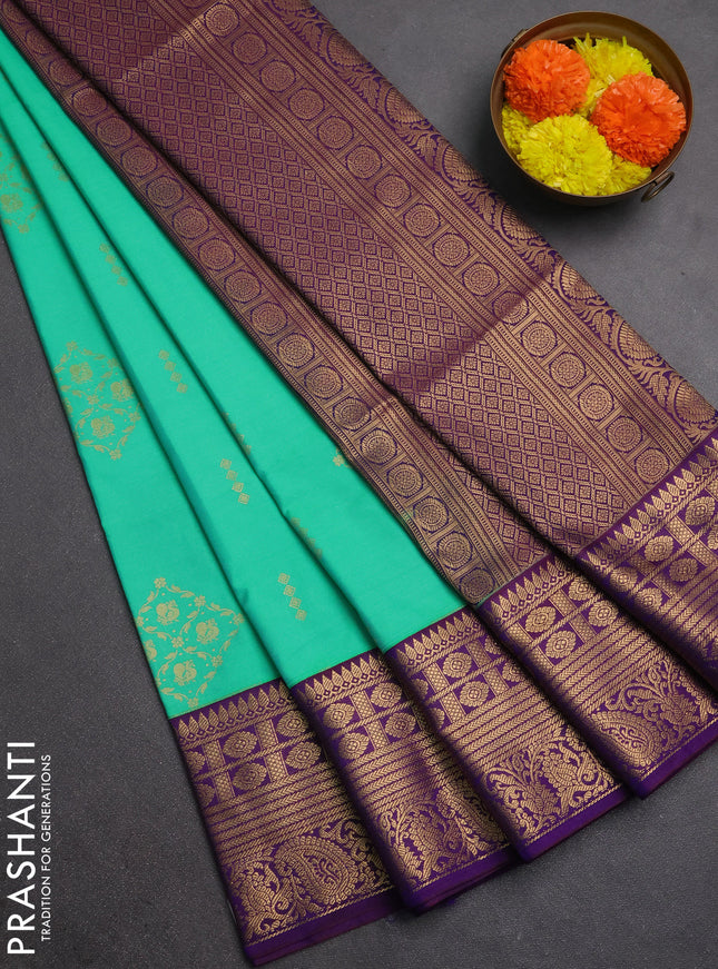 Semi soft silk saree green and purple with allover zari woven buttas and zari woven border