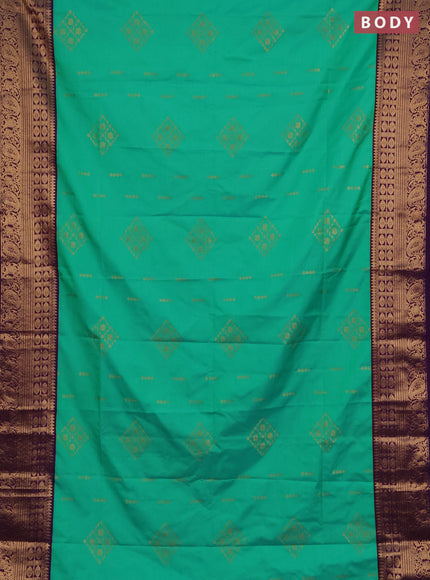 Semi soft silk saree green and purple with allover zari woven buttas and zari woven border
