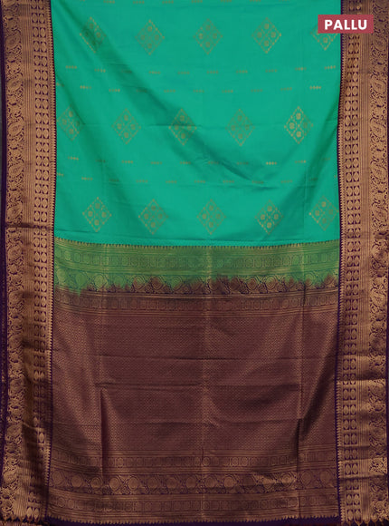 Semi soft silk saree green and purple with allover zari woven buttas and zari woven border