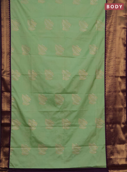 Semi soft silk saree mild pista green and purple with allover silver & gold zari woven buttas and zari woven border