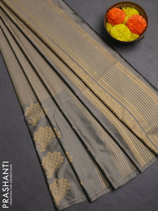 Semi soft silk saree grey shade with allover small silver zari checked pattern and long zari woven border