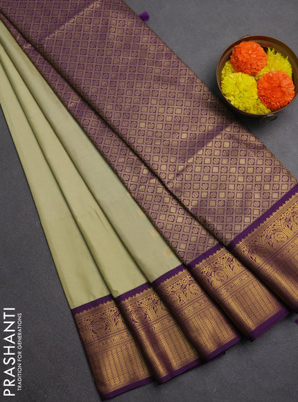 Semi soft silk saree pastel green and purple with allover zari woven buttas and zari woven border