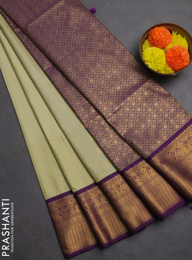 Semi soft silk saree pastel green and purple with allover zari woven buttas and zari woven border