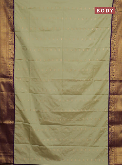 Semi soft silk saree pastel green and purple with allover zari woven buttas and zari woven border