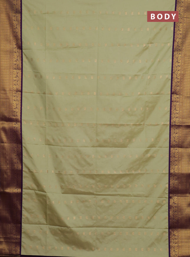 Semi soft silk saree pastel green and purple with allover zari woven buttas and zari woven border