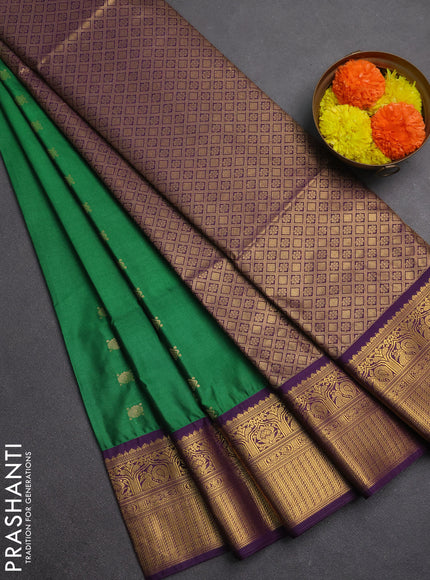 Semi soft silk saree green and purple with allover zari woven buttas and zari woven border
