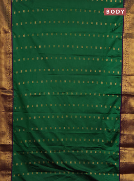 Semi soft silk saree green and purple with allover zari woven buttas and zari woven border