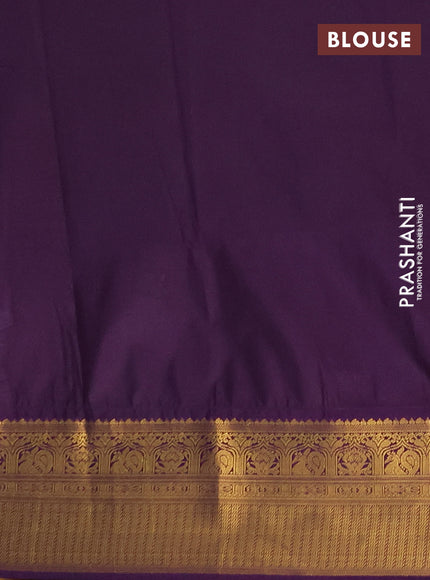Semi soft silk saree green and purple with allover zari woven buttas and zari woven border