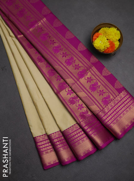 Semi soft silk saree beige and magenta pink with allover zari woven buttas and zari woven border