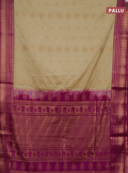 Semi soft silk saree beige and magenta pink with allover zari woven buttas and zari woven border