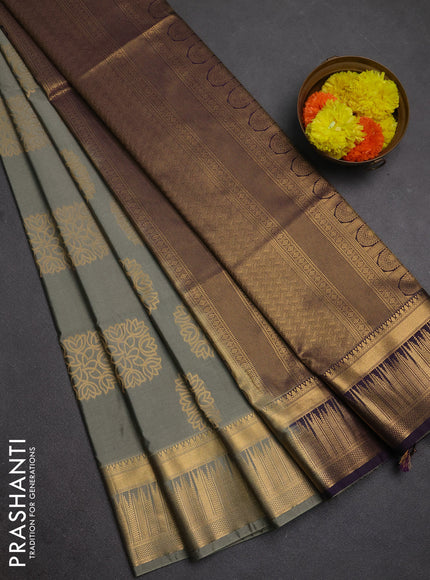 Semi soft silk saree grey shade and purple with allover zari woven buttas and zari woven border