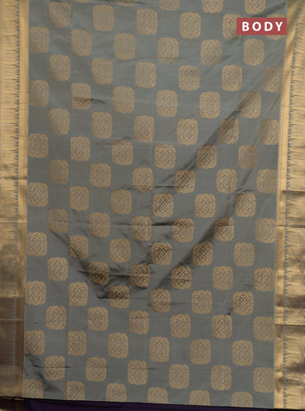 Semi soft silk saree grey shade and purple with allover zari woven buttas and zari woven border