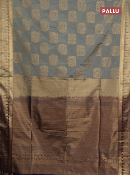 Semi soft silk saree grey shade and purple with allover zari woven buttas and zari woven border