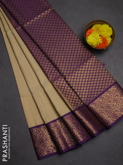 Semi soft silk saree beige and purple with allover zari brocade weaves and zari woven border