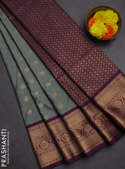 Semi soft silk saree grey shade and purple with allover zari woven buttas and zari woven border