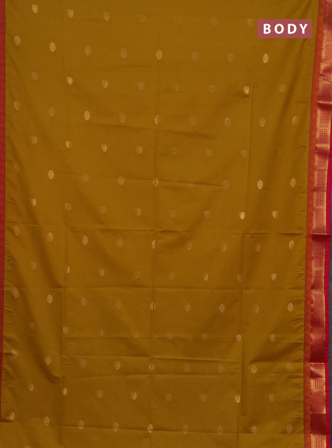 Semi soft silk saree mustard yellow and pink with zari woven buttas and temple design zari woven border