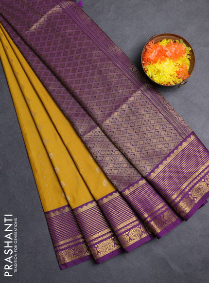 Semi soft silk saree mustard yellow and purple with allover zari woven buttas and zari woven border