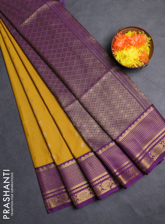 Semi soft silk saree mustard yellow and purple with allover zari woven buttas and zari woven border