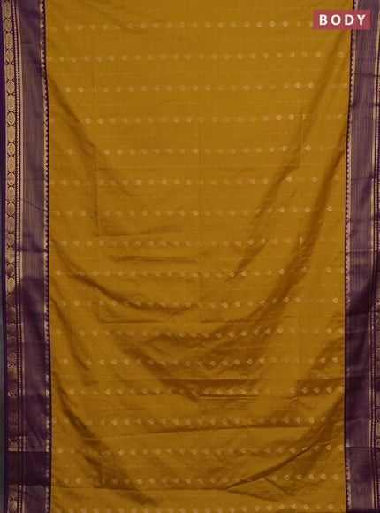 Semi soft silk saree mustard yellow and purple with allover zari woven buttas and zari woven border