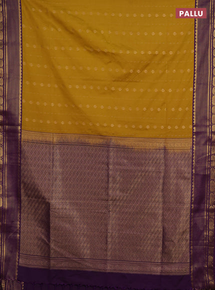 Semi soft silk saree mustard yellow and purple with allover zari woven buttas and zari woven border