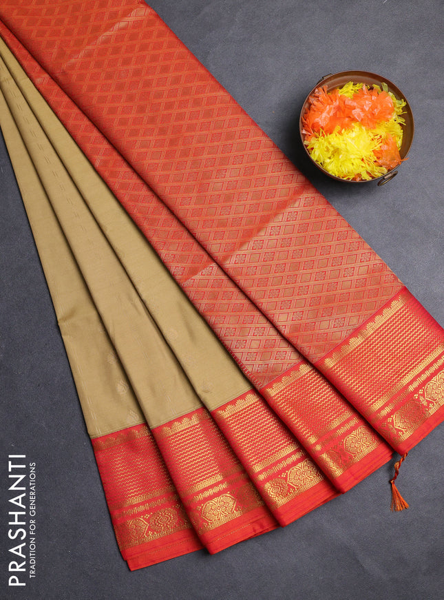 Semi soft silk saree elachi green and orange with allover zari woven buttas and zari woven border