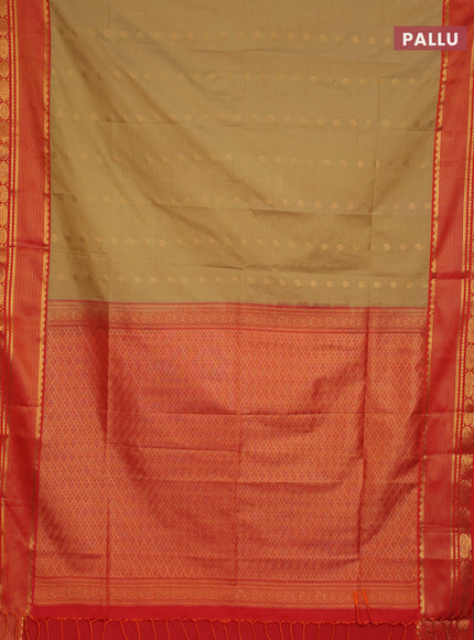 Semi soft silk saree elachi green and orange with allover zari woven buttas and zari woven border