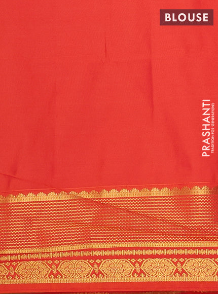 Semi soft silk saree elachi green and orange with allover zari woven buttas and zari woven border