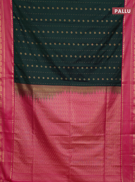 Semi soft silk saree bottle green and pink with allover zari woven buttas and zari woven border