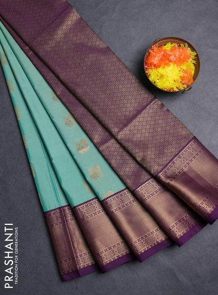 Semi soft silk saree teal green shade and purple with allover zari woven buttas and zari woven border