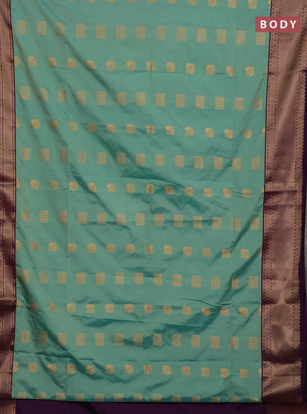 Semi soft silk saree teal green shade and purple with allover zari woven buttas and zari woven border