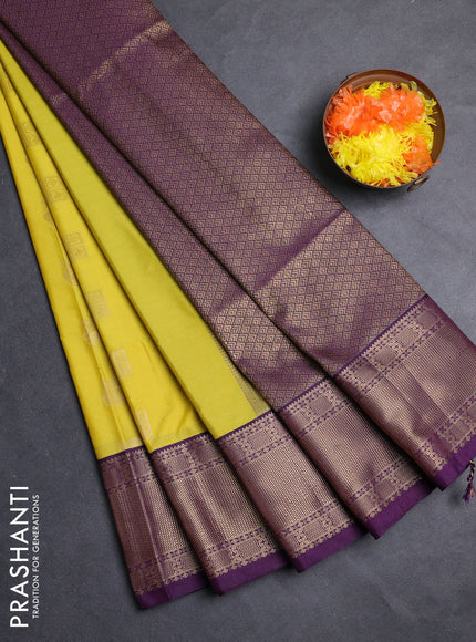 Semi soft silk saree yellow and purple with allover zari woven buttas and zari woven border