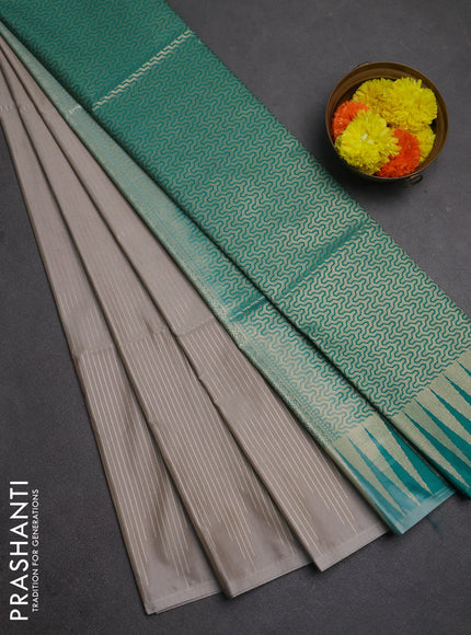 Semi soft silk saree grey and teal green with allover zari weaves in borderless style