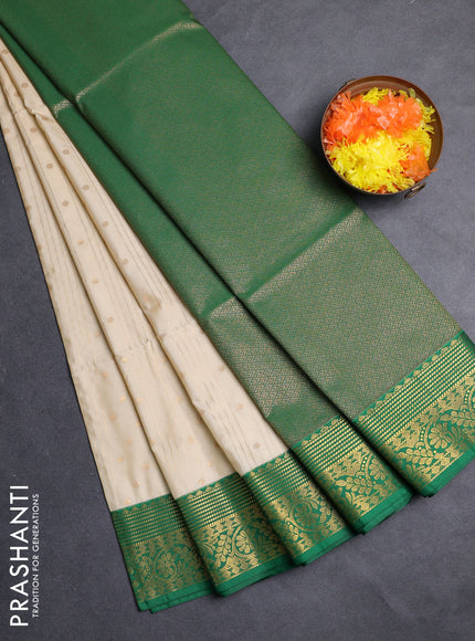 Semi soft silk saree cream and green with allover zari weaves & buttas and zari woven border