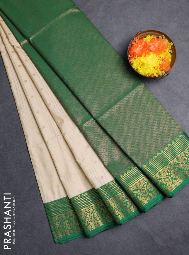 Semi soft silk saree cream and green with allover zari weaves & buttas and zari woven border