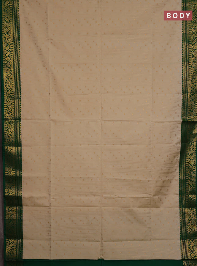 Semi soft silk saree cream and green with allover zari weaves & buttas and zari woven border
