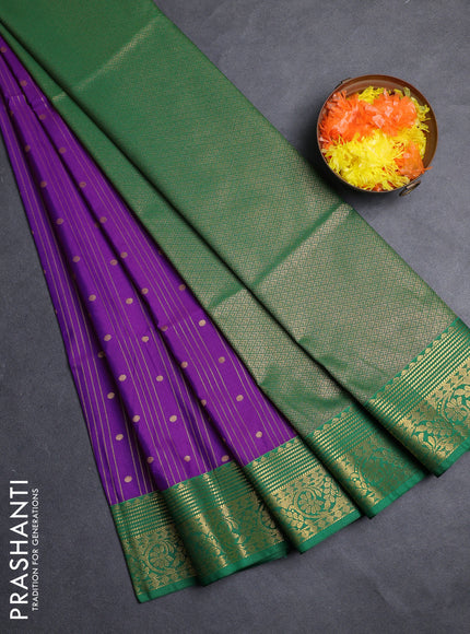 Semi soft silk saree purple and green with allover zari weaves & buttas and zari woven border
